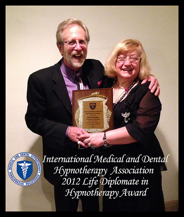 Debbie Papadakis receiving IMDHA 2012 Life Diplomat in Hypnotherapy Award from Robert Otto